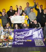 BEAR RUN 74 RAISES 10K!. . . . . .Keith ‘Bear’ Gamble pictured at Foyle Down Syndrome Trust’s HQ on Monday last with the Mayor, Graham Warke, to hand over a cheque for £10,172.00, proceeds of the recent ‘Bear Run 74’. The Trust is the Mayor’s chosen charity for this year and another number of events are to be held before the end of his year as the city and district’s first citizen. Included is Christoper Cooper, manager, FDST, staff and service users. (Photo: Jim McCafferty Photography)
