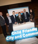 Mayor of Derry City and Strabane District Council, Councillor Ruairí McHugh, signing UNICEF's declaration to uphold the rights of all the Children and Young People in the Council area.