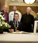 The Mayor of Derry City and Strabane District Council, John Boyle signing the Book of Condolence for Lyra McKee in the Guildhall today.