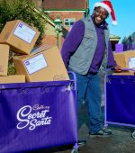 Caption: Cadbury Secret Santa postal worker Jeff is surrounded by boxes of chocolate bars, ready to be posted on the Cadbury Secret Santa Express train to cities across the country. This comes as the nation's favourite chocolate brand announces the return of its much-loved postal service initiative, where 120,000 bars are available to generously gift for free, in secret, to a loved one this Christmas. Image credit: Ray Burmiston