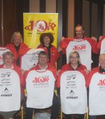Committee 1 - North West 10k Chairperson Neil Martin (seated second from left) with Committee members at the new T-shirt launch on Monday evening in the Mount Errigal Hotel. Also included at front Anne Condon, Mary Fleming-McCrossan and Neily McDaid. Back from left - Declan Kerr, Bernie Brennan, Nancy McNamee, Seamus Murphy and Brendan McDaid