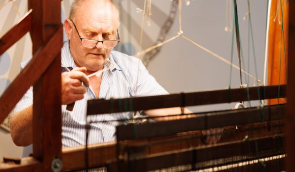 Image 5 Master Weaver John Heena at work demonstrating the handweaving process of Irish Tweed