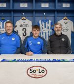 BALLYBOFEY, IRELAND - SEPTEMBER 25 2024: Finn Harps Academy graduate, Kevin Jordan, signs a two-year deal with Finn Harps. Pictured left to right are Rory White (Finn Harps Secretary), Max Johnston, Tommy Canning (Finn Harps Coach) at Finn Park in Ballybofey, Donegal. (Photo by Clare McCahill)