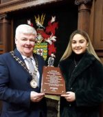 Donegal boxing champion Leah Gallen making presentation to Cathaoirleach of Donegal County Council Cllr. Nicholas Crossan on behalf of the England Boxing Team that visited Donegal last week.