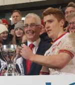Peter Harte accepts the Dr. McKenna Cup. Photo: @TyroneGAALive