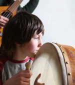 "boy playing on bodhran, on irish tradition drum at a trad sessionmore music:"