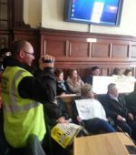 Protestors in the council chamber.