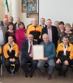 Cllr. John Seamais O’Fearraigh, Cathaoirleach Glenties Municipal District presents the citation to Pat Crean for Paul McFadden, Softball Player and Fair Play Award with Bocce players Peter Doogan, Patrick Gallagher and Ronan Corbett with family and friends at the Reception for Special Olympic Athletes in Dungloe Public Service Office on Tuesday last. Also pictured is Cllr. Enda Bonner, Cllr. Terence Slowey and Cllr. Maire Therese Gallagher. Photo Clive Wasson