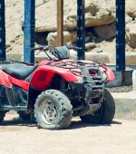 Old broken quad bike in the desert