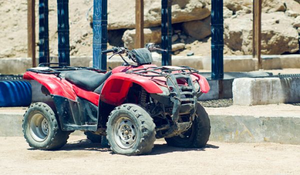 Old broken quad bike in the desert