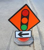 Traffic lights signage, advising motorists to slow down and stop at the lights.