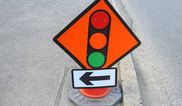 Traffic lights signage, advising motorists to slow down and stop at the lights.