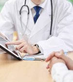 Hands of a male doctor explaining to the elderly