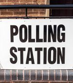 A 'Polling Station' sign outside village hall during a UK election.