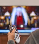 women watching tv and use remote controller